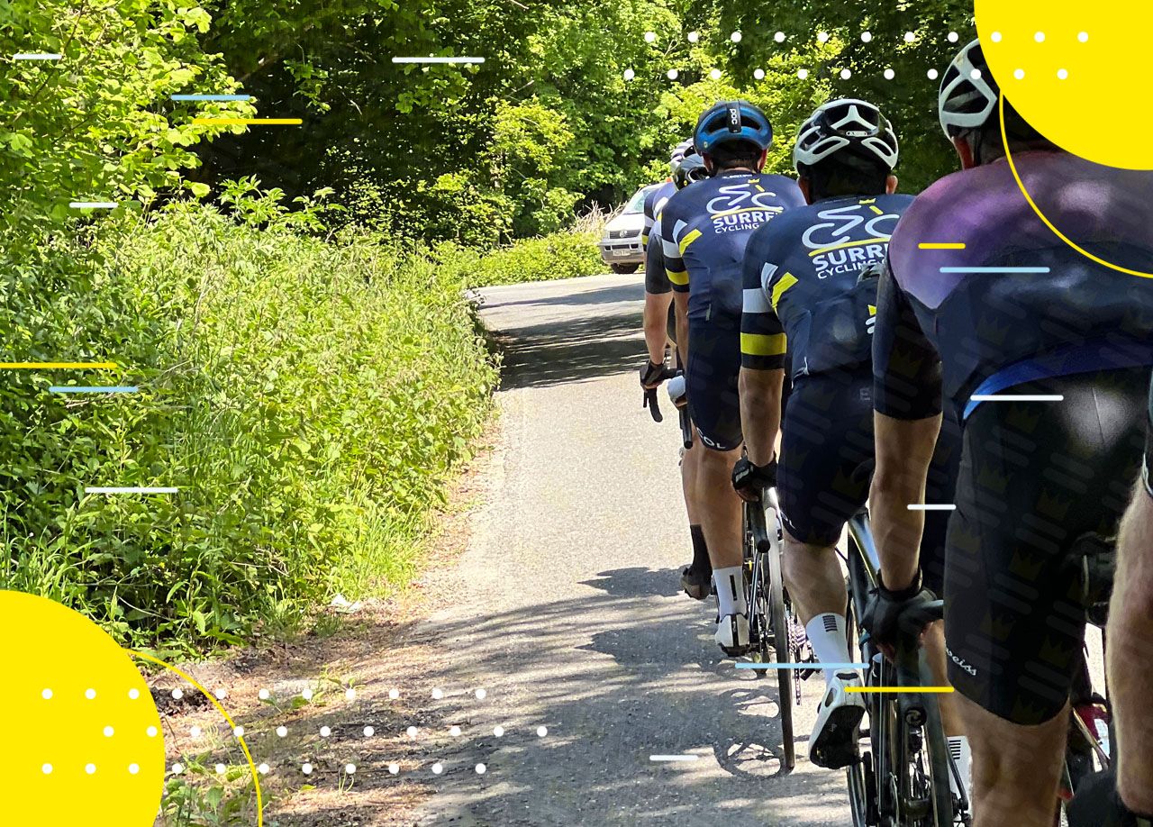 A Surrey Cycling Club cycling down a road.