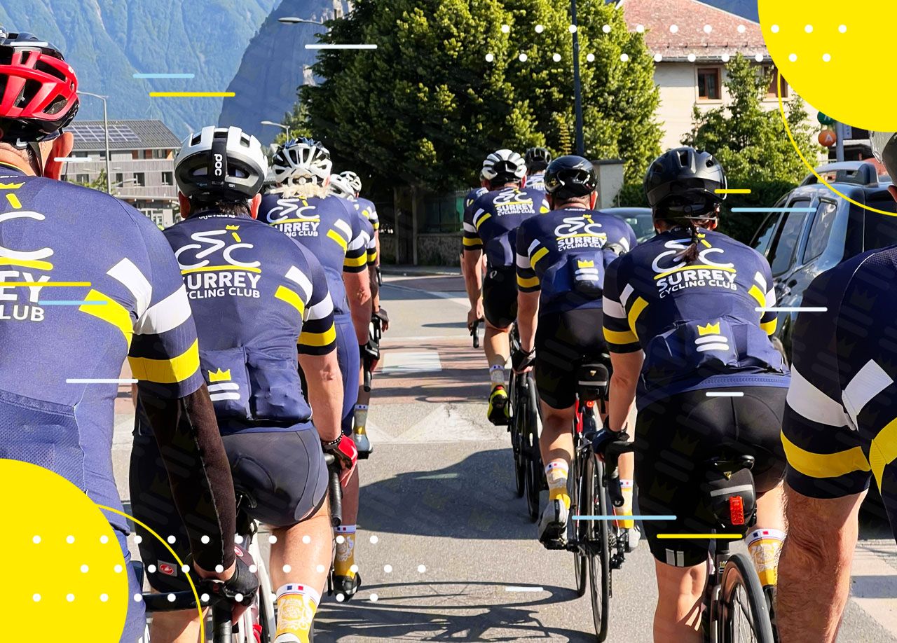 A Surrey Cycling Club rides down a street.