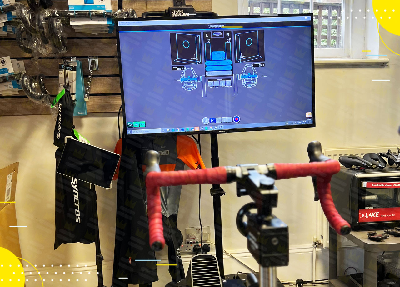 A bicycle is on display in a room with a tv.