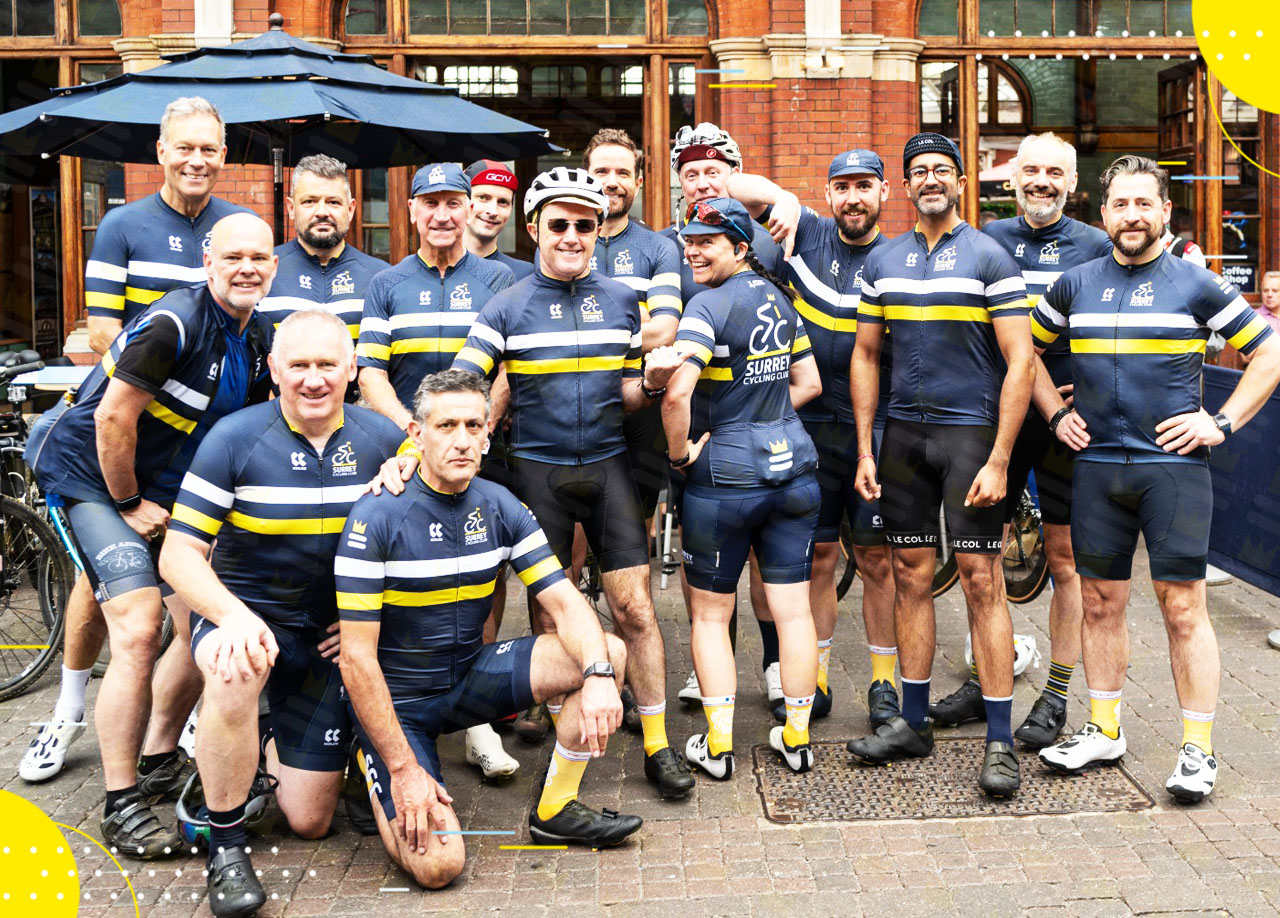 A group of cyclists posing for a photo.