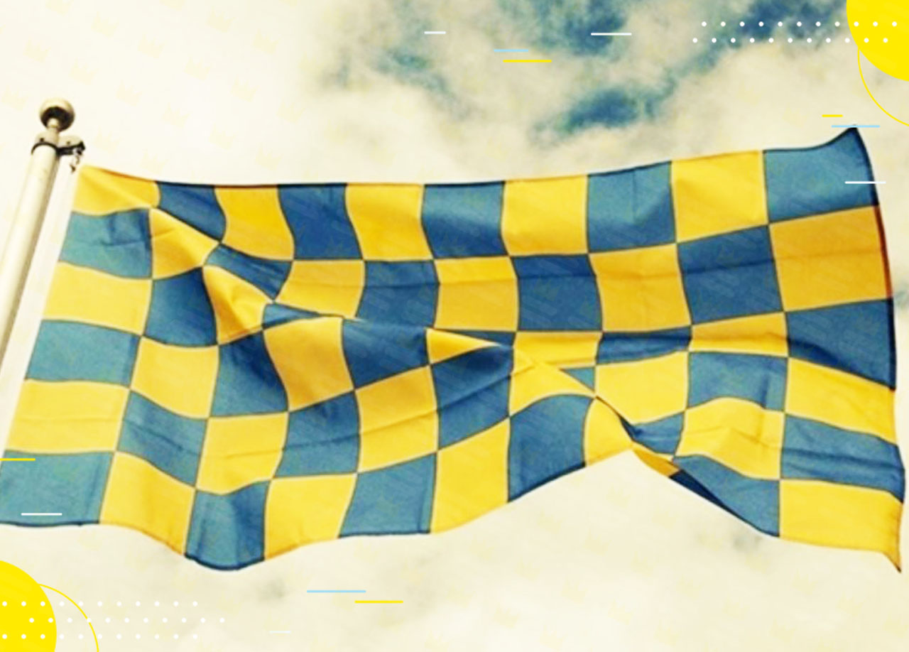 A blue and yellow flag flying in the wind.