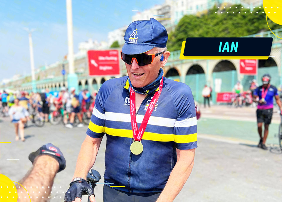 A man with a medal on his head is riding a bike.