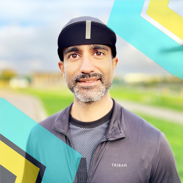 A cyclist wearing a hat in front of a colorful background, representing Surrey Cycling Club.